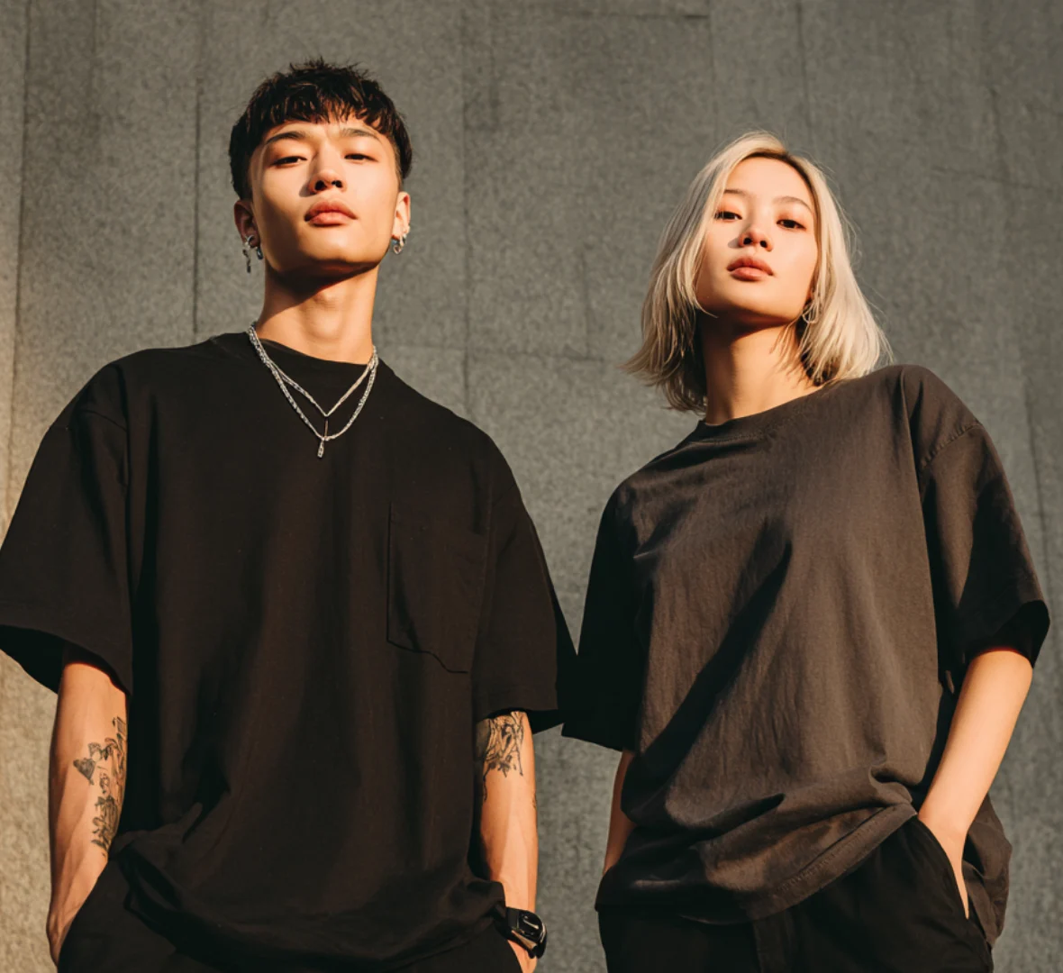 Two models in Ghost Wolf tees, late afternoon light