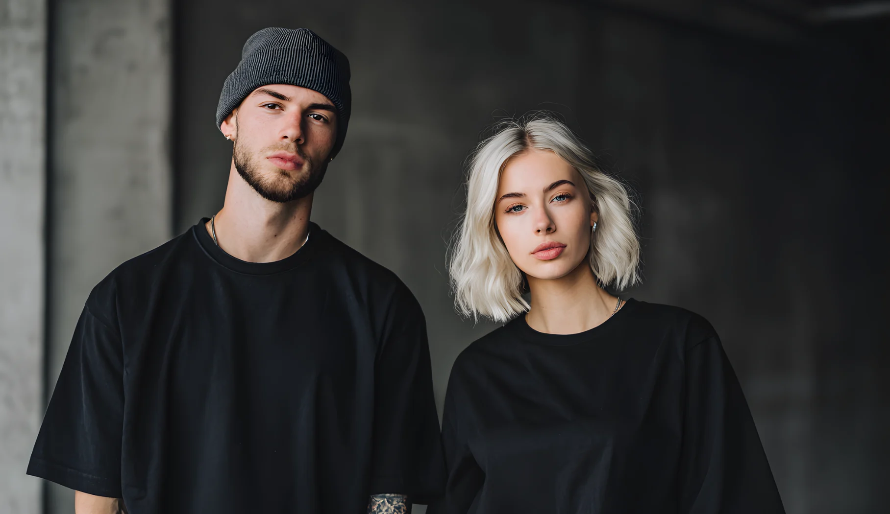 Two models in oversized black Ghost Wolf tees